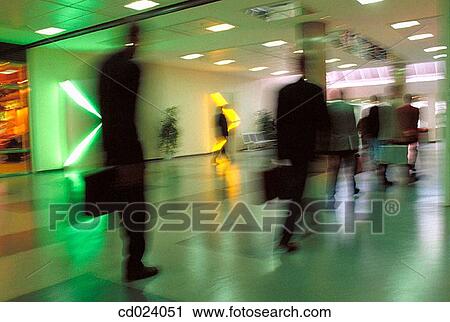 Stock Image - businesspeople, activity, businessman, business, blurred motion, action. Fotosearch