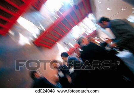 Stock Photo - businesspeople, activity, businessman, business, blurred, action. Fotosearch