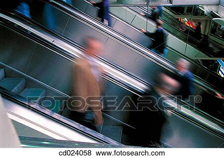Stock Photo - businesspeople, activity, businessman, business, blurred motion, action. Fotosearch