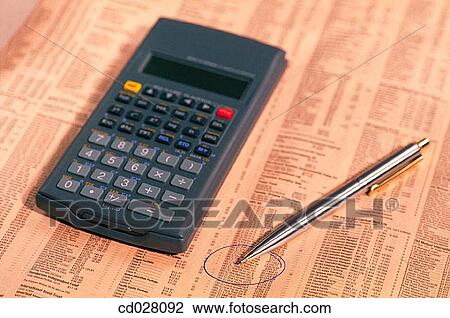 Stock Image - Calculator on stock market report. Fotosearch