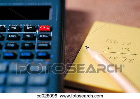 Stock Photography - Calculator, pencil and yellow pad. Fotosearch