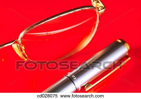 Stock Photography - Eyeglasses and pen. Fotosearch