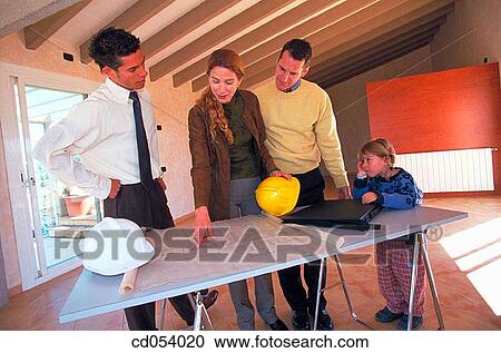 Family looking at blueprint of their new house View Large Photo Image Stock Image - Family looking at blueprint of their new house. Fotosearch