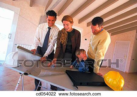 Family looking at blueprint of their new house View Large Photo Image Stock Image - Family looking at blueprint of their new house. Fotosearch