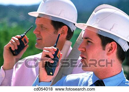 Giving orders by walkie-talkie View Large Photo Image Stock Photo - Giving orders by walkie-talkie. Fotosearch