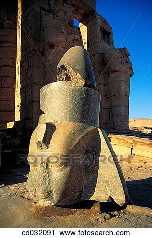 Stock Image - Head of Ramses statue. Ramesseum, funerary temple of Ramses II on the West Bank of the Nile. Luxor (ancient egyptian city of Thebes). Fotosearch