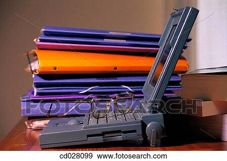 Laptop computer, eyeglasses and files View Large Photo Image Stock Photo - Laptop computer, eyeglasses and files. Fotosearch