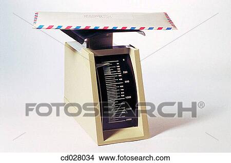 Letter being weighed on office scales View Large Photo Image Picture - Letter being weighed on office scales. Fotosearch