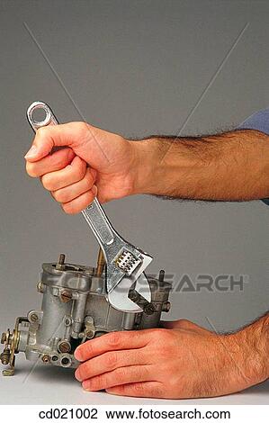 Monkey wrench and carburetor View Large Photo Image Stock Image - Monkey wrench and carburetor. Fotosearch
