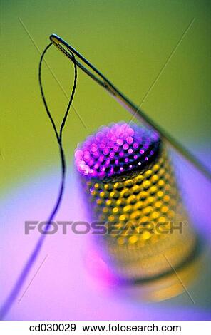 Needle, thread and thimble View Large Photo Image Stock Photo - Needle, thread and thimble. Fotosearch