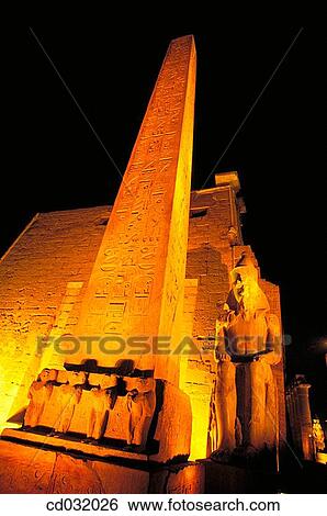 Obelisk and statue of Ramses II. Luxor (ancient egyptian city of Thebes). East Bank of the Nile View Large Photo Image Stock Photograph - Obelisk and statue of Ramses II. Luxor (ancient egyptian city of Thebes). East Bank of the Nile. Fotosearch