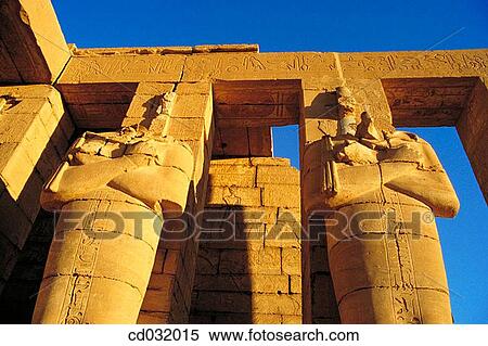 Osiris Pillars. Ramesseum, funerary temple of Ramses II on the West Bank of the Nile. Luxor (ancient egyptian city of Thebes) View Large Photo Image Stock Photography - Osiris Pillars. Ramesseum, funerary temple of Ramses II on the West Bank of the Nile. Luxor (ancient egyptian city of Thebes). Fotosearch