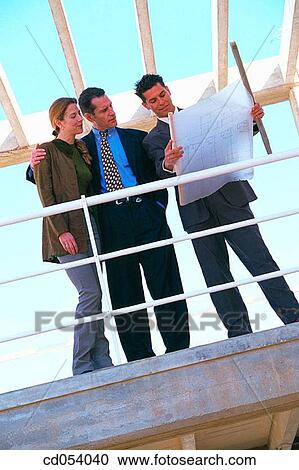Real estate. Couple and contractor View Large Photo Image Stock Image - Real estate. Couple and contractor. Fotosearch
