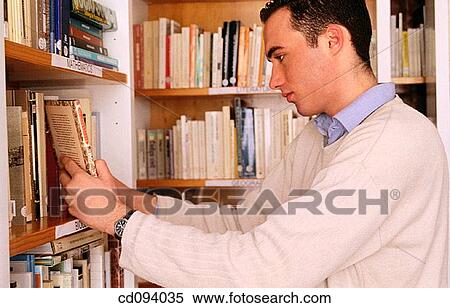 adolescence, boy, bookcase, book, activity View Large Photo Image Stock Photography - adolescence, boy, bookcase, book, activity. Fotosearch