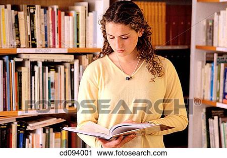 adolescence, brunette, bookcase, book, activity View Large Photo Image Stock Image - adolescence, brunette, bookcase, book, activity. Fotosearch