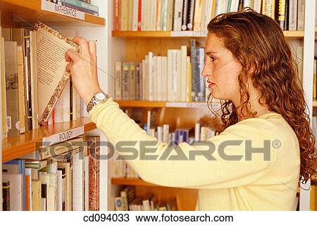 adolescence, brunette, bookcase, book, activity View Large Photo Image Stock Image - adolescence, brunette, bookcase, book, activity. Fotosearch