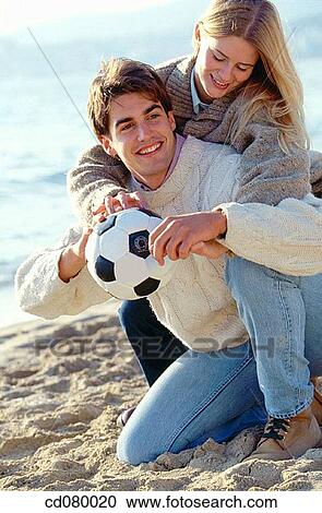Stock Image - affection, beach, ball, amusement, activity. Fotosearch