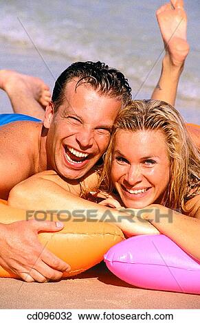 Stock Image - air mattress, Arms crossed, amusement, air-bed, affection. Fotosearch