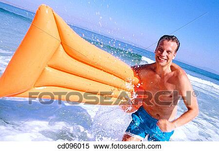Stock Photography - air mattress, bathing-suit, amusement, air-bed, activity. Fotosearch