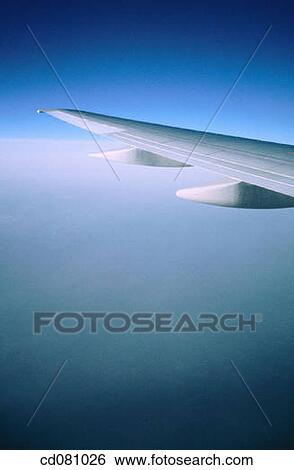 Stock Photograph - Airplane wing during flight. Fotosearch