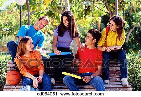 Stock Image - amusement, bench, ball, backpack, adolescence. Fotosearch