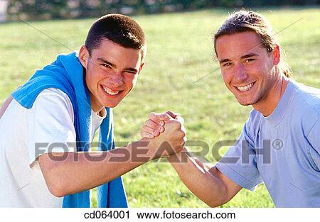 arm wrestling, carefree, boy, black hair, adolescence View Large Photo Image Stock Image - arm wrestling, carefree, boy, black hair, adolescence. Fotosearch
