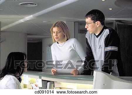 Picture - ask, baby boomer, attentive, attention, Admission desk. Fotosearch