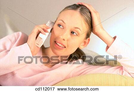 Stock Photo - at-home, calling, brunette, activity. Fotosearch