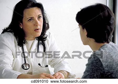 Stock Image - attentive, brunette, baby boomer, attention. Fotosearch