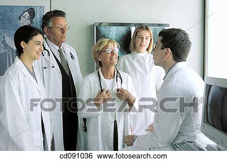 Stock Photograph - attentive, collaboration, baby boomer, attention. Fotosearch