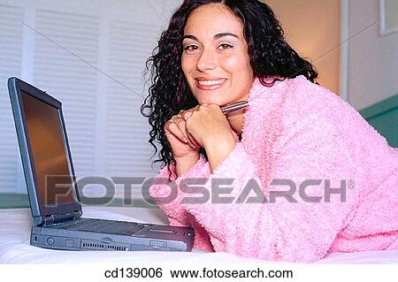 Stock Photograph - bathrobe, brunette, bedroom, at-home. Fotosearch