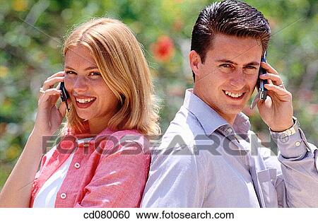 Stock Image - Best friend, black hair, blond, carefree. Fotosearch