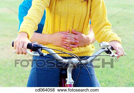 Stock Photo - Best friend, boy, bicycle, adolescence. Fotosearch