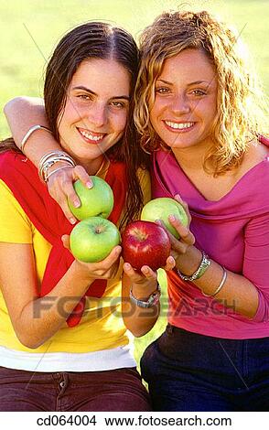 Best friend, carefree, brunette, apple View Large Photo Image Picture - Best friend, carefree, brunette, apple. Fotosearch