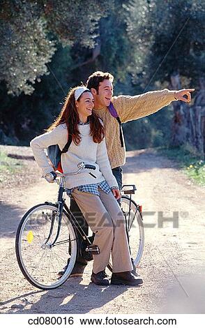 Best friend, carefree, brunette, bicycle, adolescence View Large Photo Image Stock Photograph - Best friend, carefree, brunette, bicycle, adolescence. Fotosearch