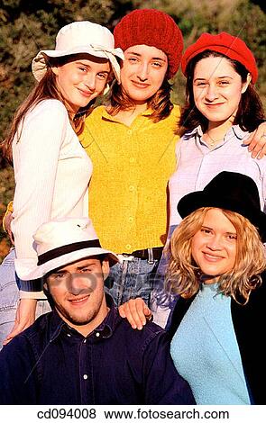 Stock Photo - Best friend, close friend, cap, boy, adolescence. Fotosearch