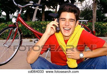 Stock Image - bicycle, carefree, boy, black hair, adolescence. Fotosearch