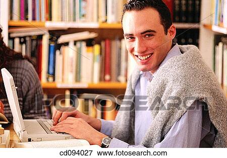 boy, adolescence, bookcase, book, black hair, activity View Large Photo Image Stock Photo - boy, adolescence, bookcase, book, black hair, activity. Fotosearch
