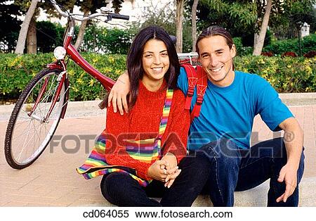 Stock Photography - boy, backpack, black hair, bicycle, Best friend, adolescence. Fotosearch