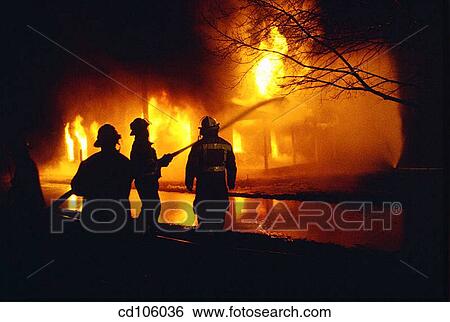 Stock Photograph - brave, catastrophe, burning, bravery, anonymous. Fotosearch