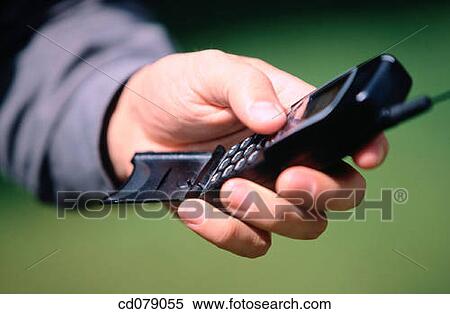 Cell phone and hand View Large Photo Image Stock Photography - Cell phone and hand. Fotosearch