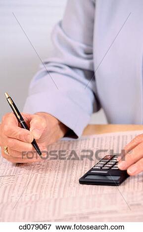 Checking financial pages View Large Photo Image Stock Photo - Checking financial pages. Fotosearch