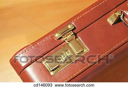 Stock Image - Combination lock on briefcase. Fotosearch