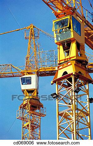 Construction cranes View Large Photo Image Stock Photograph - Construction cranes. Fotosearch