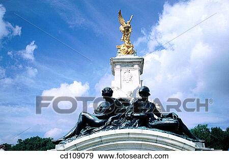 Detail of Victoria Monument, built in front of the entrance to Buckingham Palace. London. England View Large Photo Image Stock Photo - Detail of Victoria Monument, built in front of the entrance to Buckingham Palace. London. England. Fotosearch