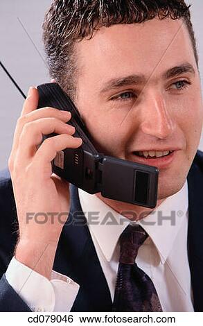 Executive on cellphone View Large Photo Image Stock Photograph - Executive on cellphone. Fotosearch