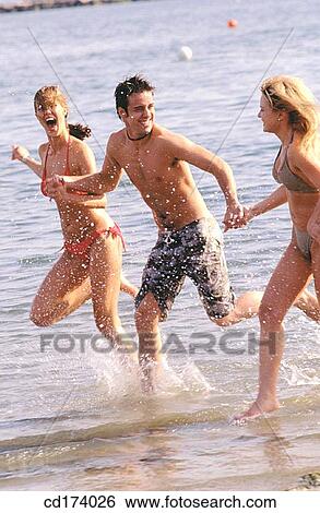 Stock Photograph - adolescence, beach, bathing-suit, amusement, activity. Fotosearch