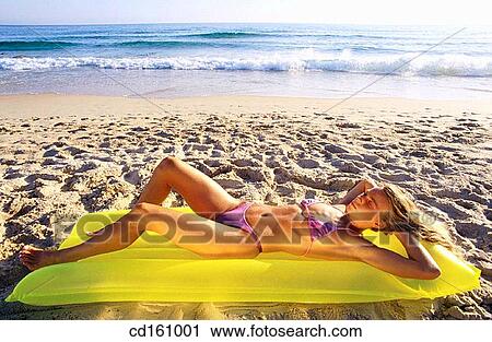 Stock Image - air-bed, beach, air mattress. Fotosearch