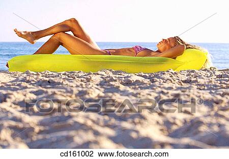 Stock Image - air-bed, beach, air mattress. Fotosearch