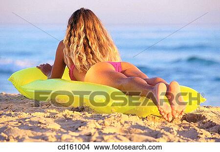 Picture - air-bed, beach, back view, air mattress. Fotosearch